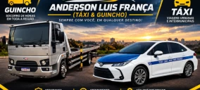 Imagem de um guincho plataforma cinza ao lado de um carro sedan branco com detalhes azuis, ambos estacionados em uma via.